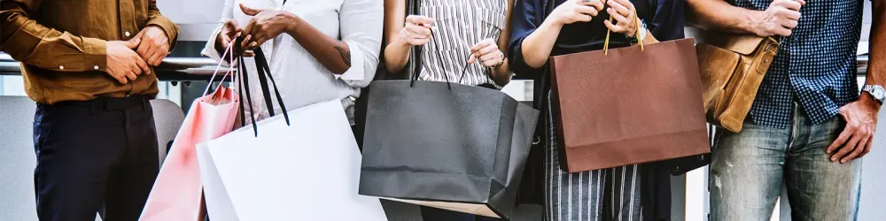 5 people with shopping bags